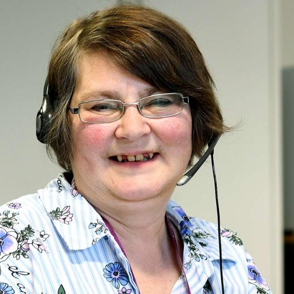 Woman wearing telephone headset