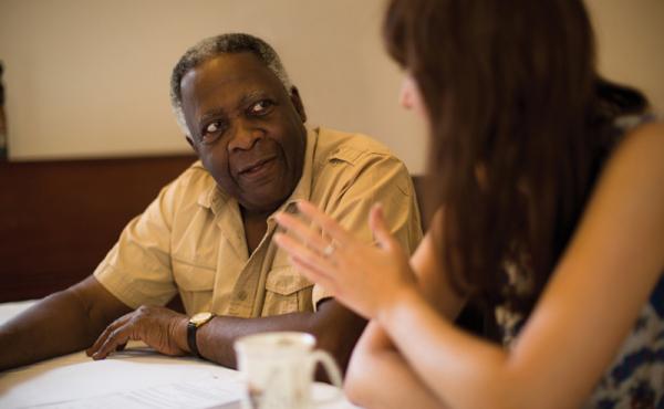 Man listening to younger woman