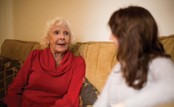 Woman talking to younger woman