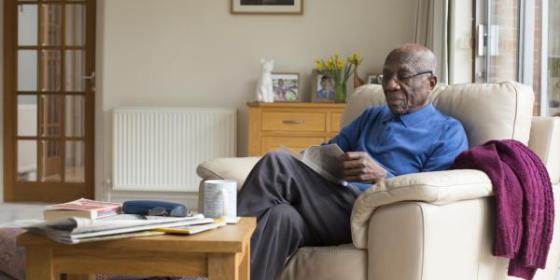 Man reading in living room 