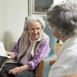 Two older people reading